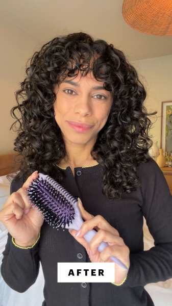 Image may contain Adult Person Hair Curly Hair and Black Hair